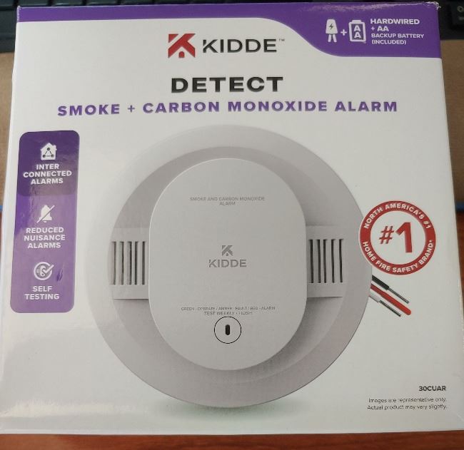 Picture of the front of a new smoke detector box
