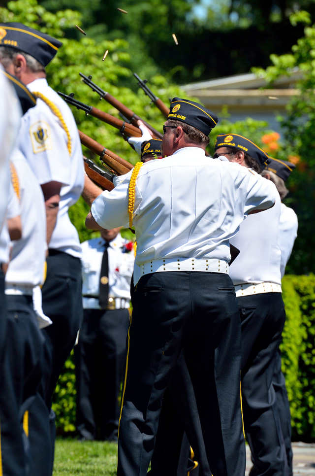 Honor Guardsmen fire rifle salute