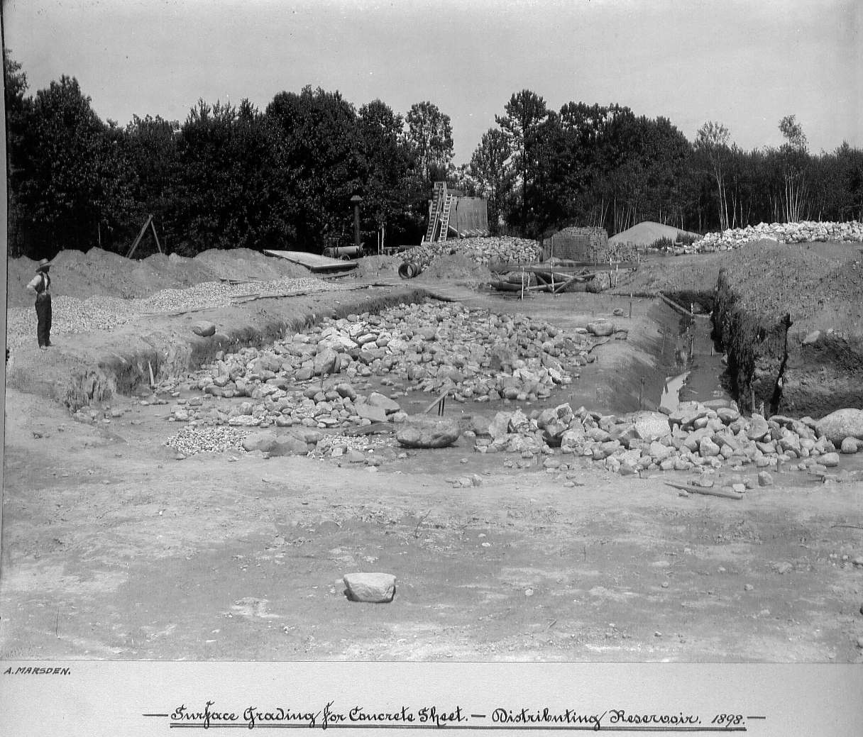 Man looking over graded surface